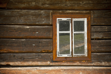 Vintage looking window of an old wooden house