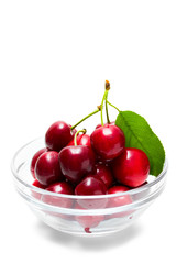 cherries on glass bowl isolated on white background