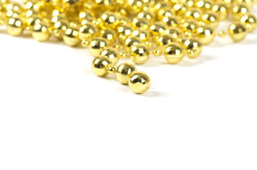 Background made of a brilliant celebratory beads of golden color