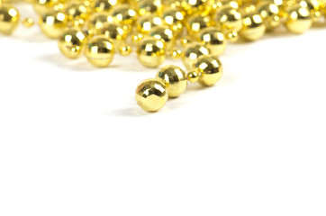 Background made of a brilliant celebratory beads of golden color