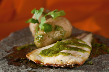 Golden with green sauce and potatoes