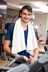 Fototapeta na wymiar young man training in the gym