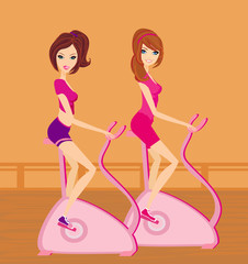 Girls on the exercise bikes