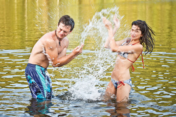Couple playing in the water
