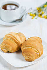 Croissants with cup of tea