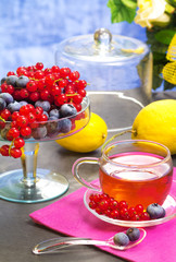 red fruits tea with nerries background