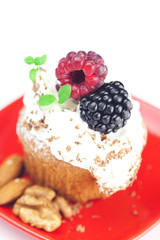 muffin with whipped cream,mint, raspberries, blackberries and nu
