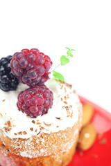 muffin with whipped cream,mint, raspberries, blackberries and nu