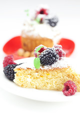muffin with whipped cream, cake with icing, raspberry, blackberr