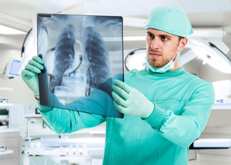Surgeon examining a radiography