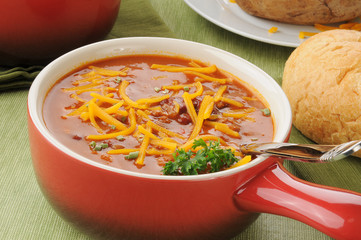 Chili with cheese in a serving crock