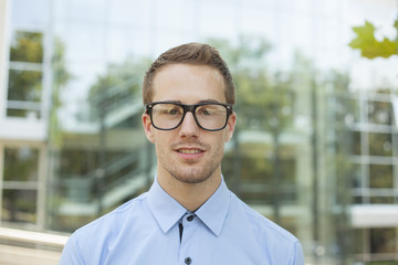 Businessman in front of business building