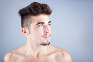 Young man profile with copyspace on grey background