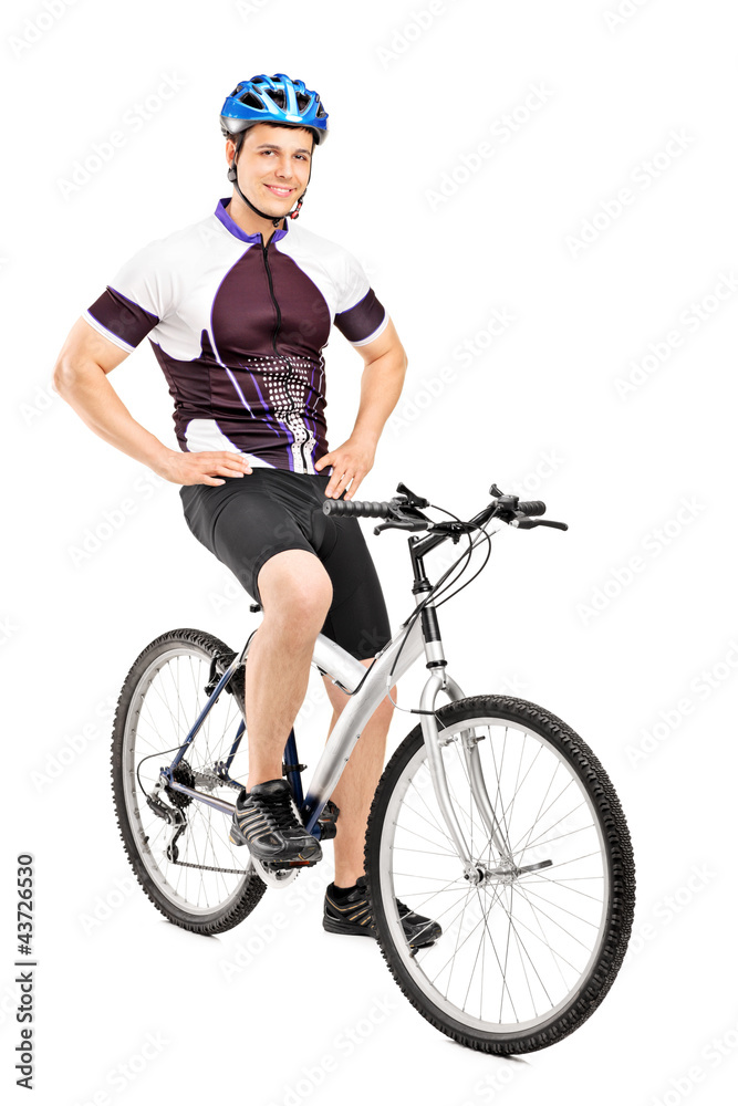 Canvas Prints Full length portrait of a smiling bicyclist posing on a bicycle