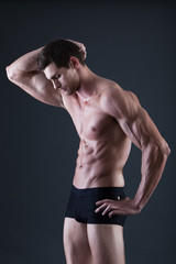 Fototapeta premium Portrait of a young sexy shirtless muscular man