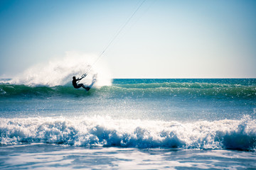Kite surfing in waves.