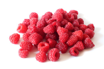 pile of fresh, juicy raspberries isolated on white background