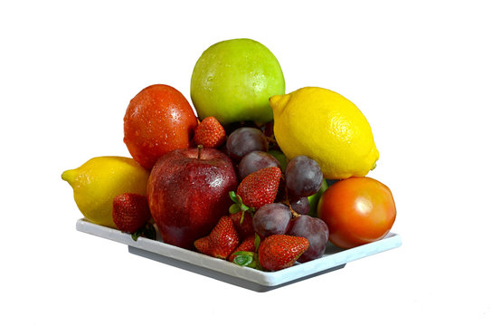 A plate of fresh fruit  pictures isolated in white