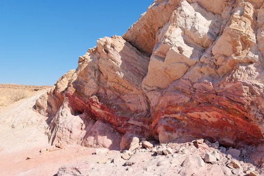 Striped pink rock in stone desert