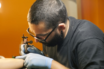 tattoo artist working