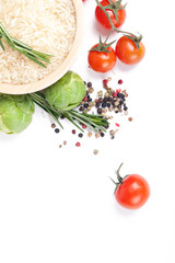 still-life of fresh vegetables and spices over white background.