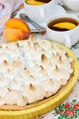Cake with meringue and peach
