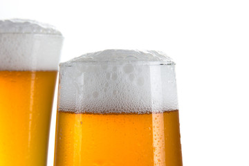 Beer in a glasses over white