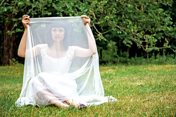 Beautiful lady in white dress ourdoors