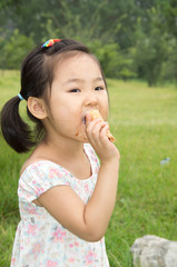 Fototapeta premium little girl eating ice cream