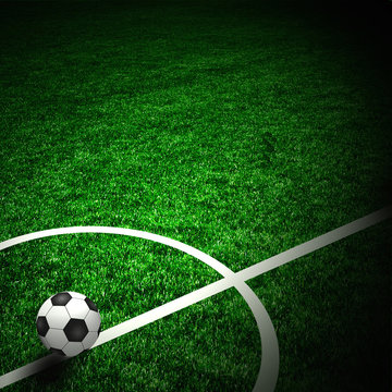 Soccer ball on the green field