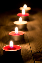 A line of burning candles