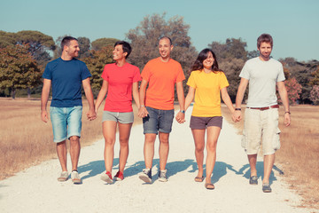 Obraz premium Group of Friends Walking Outside