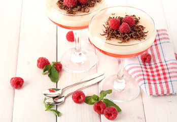 fruit jelly with berries in glasses on wooden table