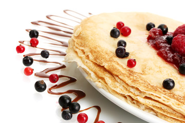 Delicious pancakes with berries and jam