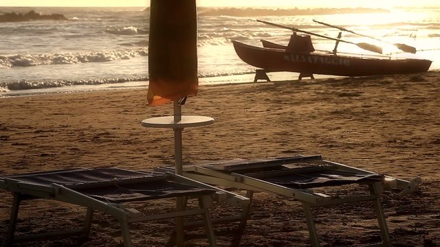 Lifeguard boat on coast at sunset