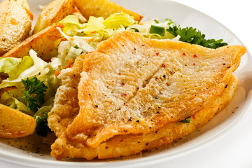 Fish dish - fried fish fillets and vegetables