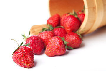 strawberries in basket hanging on a white background