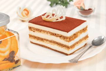 tiramisu cake and silver spoon