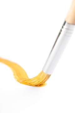 Yellow curve line drawn with paintbrush, isolated on white