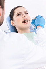 Dentist meticulously examines the oral cavity 