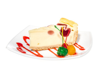 Closeup of a slice of cherry cheesecake on a white background