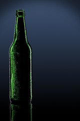 green bottle with dark background