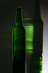 green bottle with colored reflection