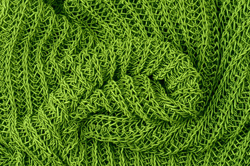 close up green knitted pullover background