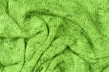 Fototapeta na wymiar bliska zielone tło dzianiny pulower