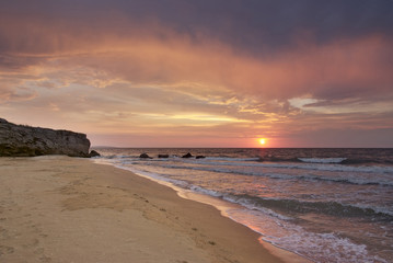 Fototapeta na wymiar sunset on the deserted beach in the Crimea