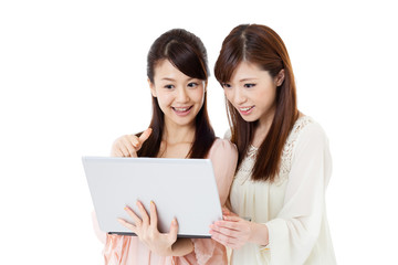 Beautiful young women using a mobile phone. Portrait of asian.