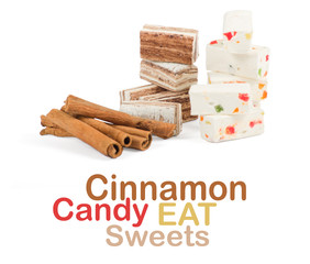 Sweets and cinnamon sticks isolated on white background