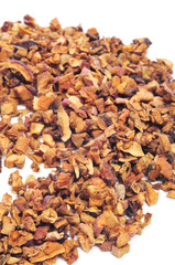 closeup of a pile of apple tea on a white background