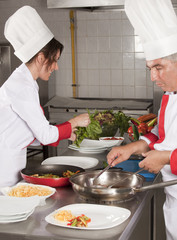 Two chefs at work in a restaurant